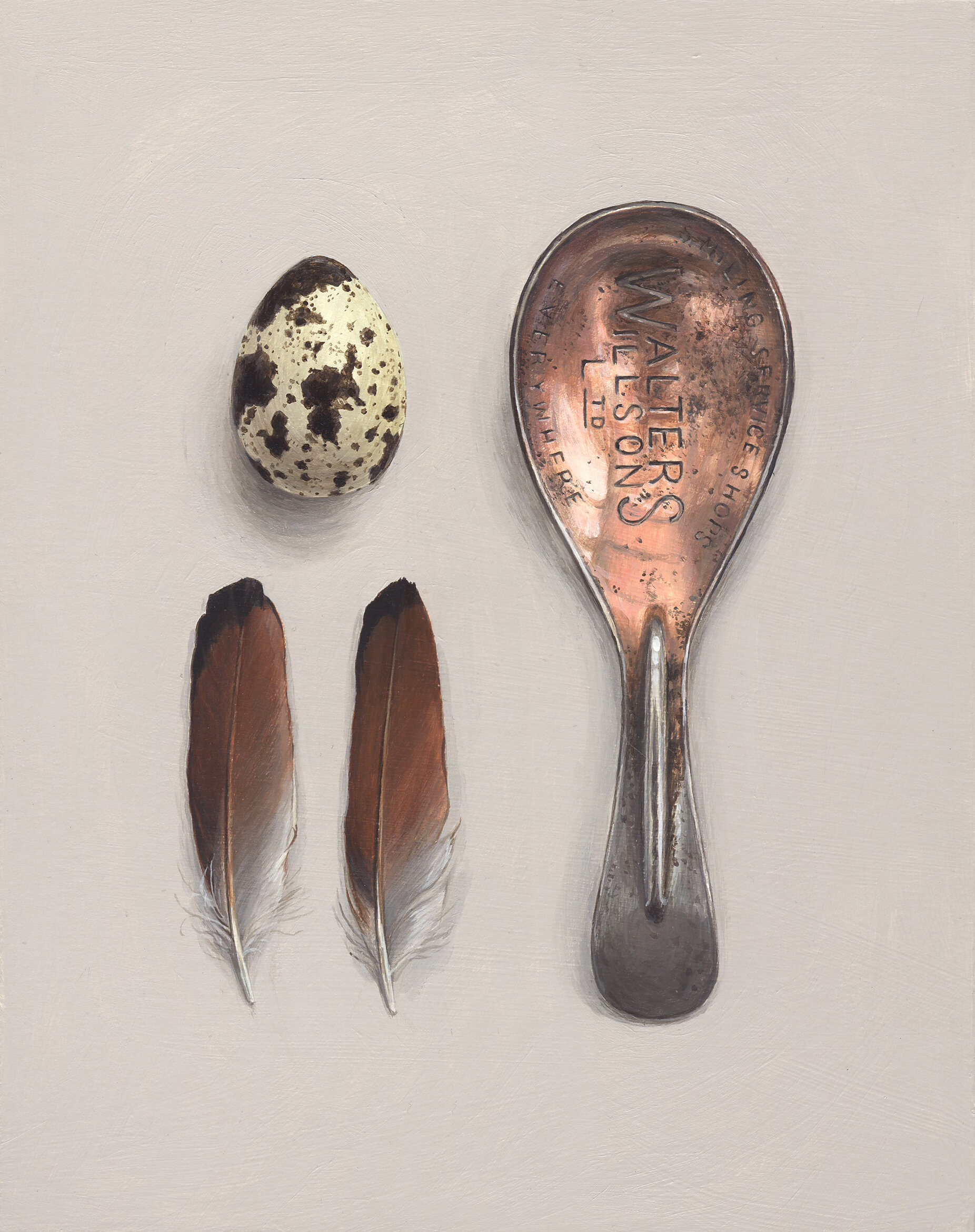 caddy spoon with egg and two feathers