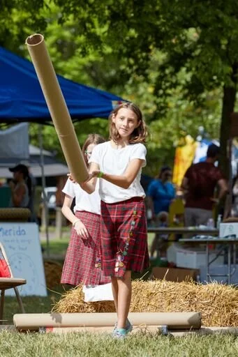 Girl throwing Pole