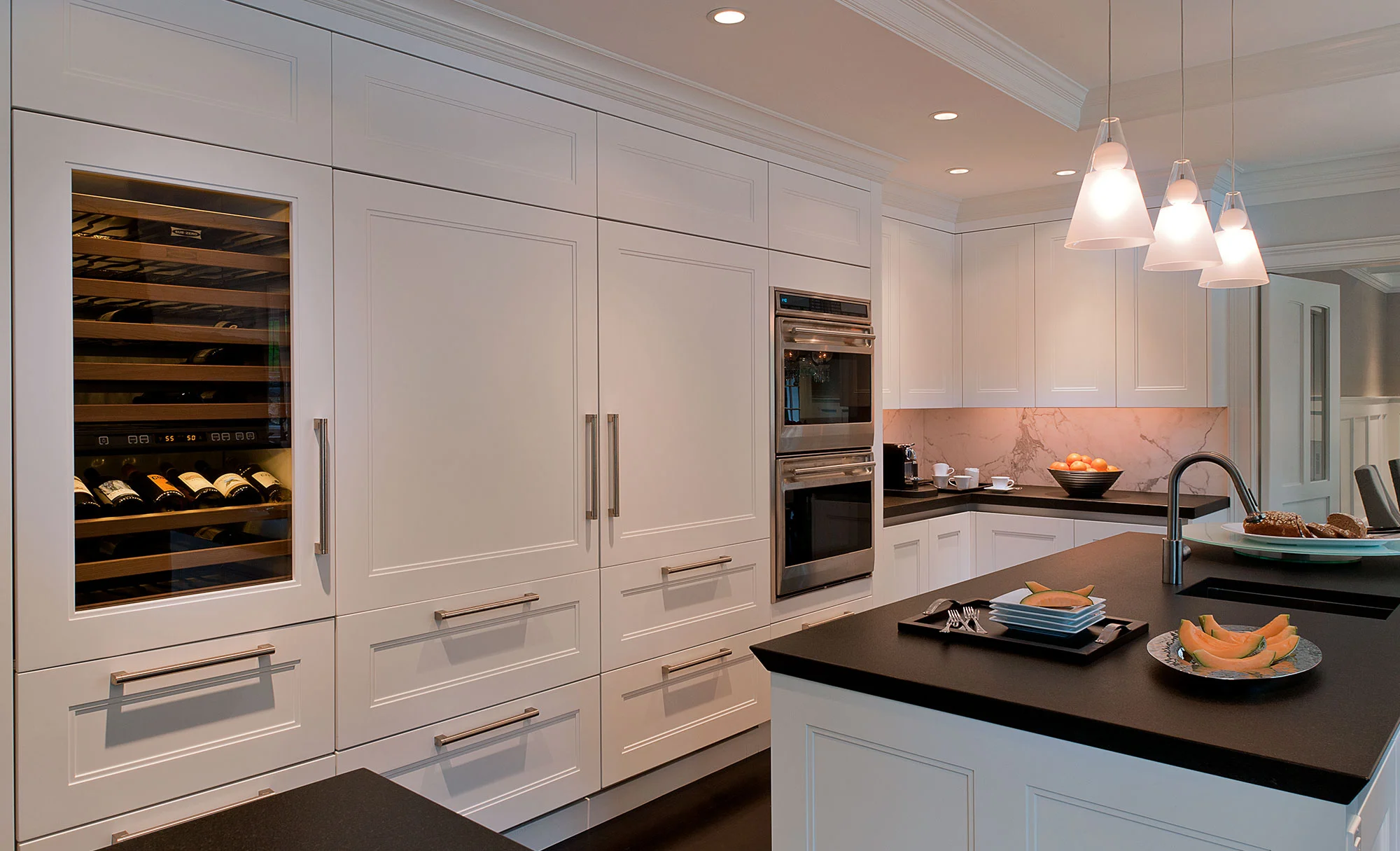 Kitchen With Ovens and A Wine Rack