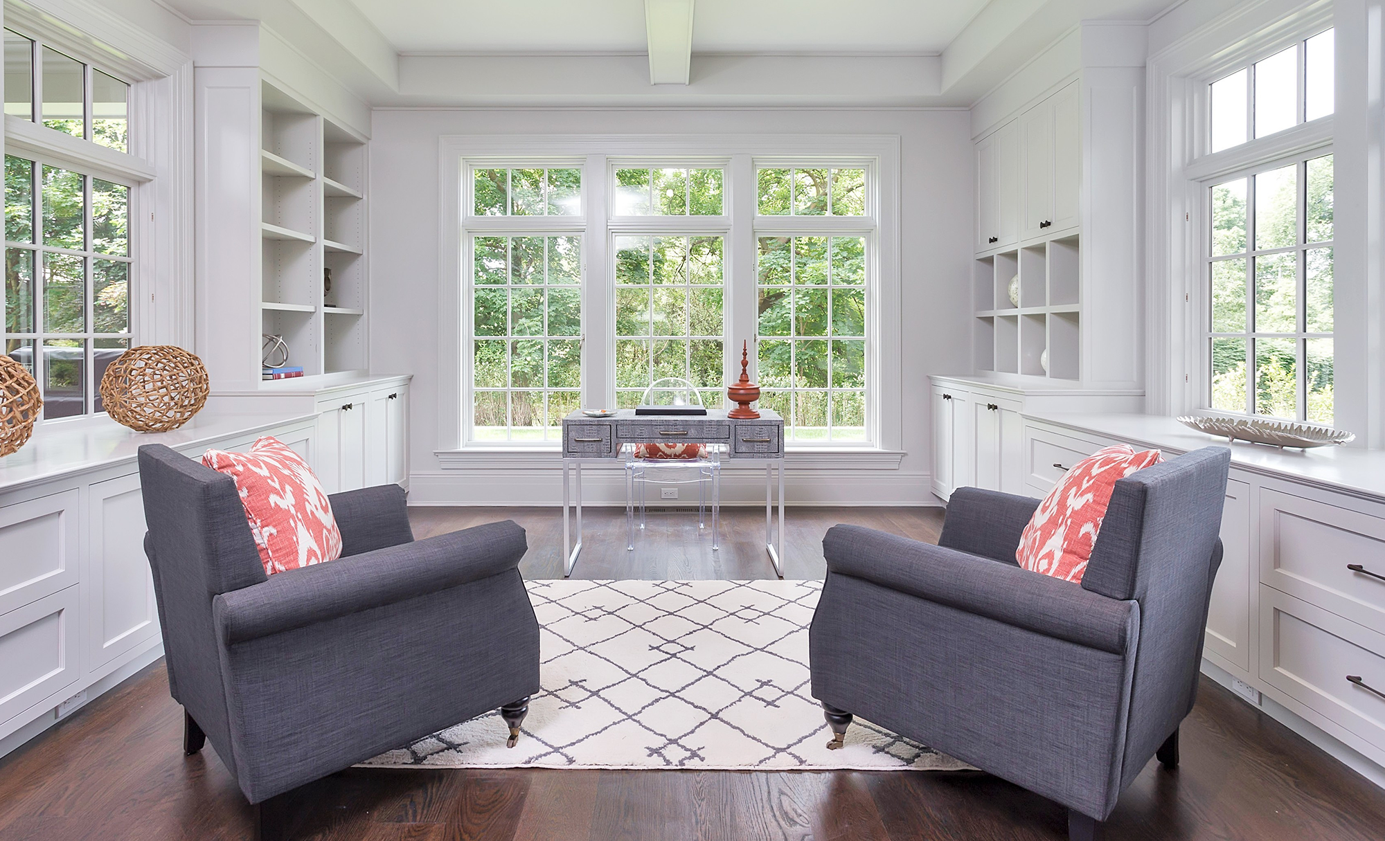 Small Sun Room With Chairs and Bookshelves