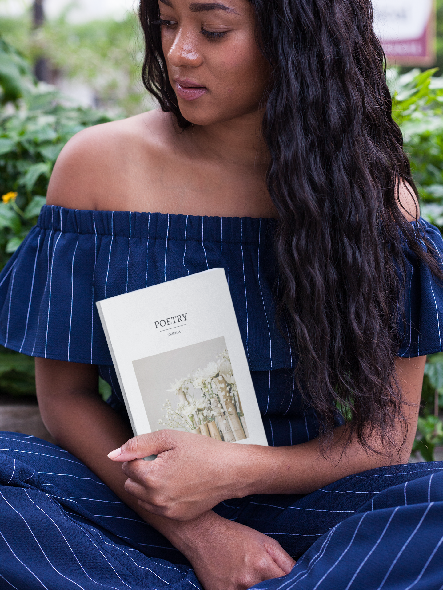 mockup-of-a-woman-holding-a-book-while-at-the-park.png