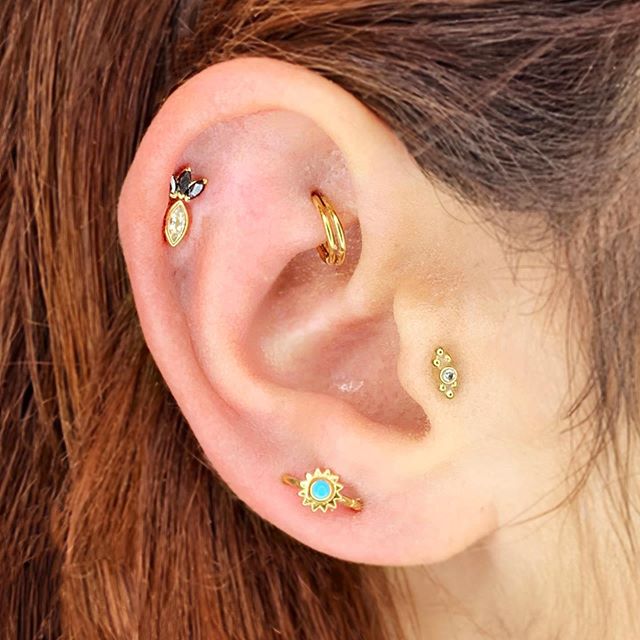 Paige @paigecarson was looking for a way to fill up the open space in her ear while utilizing jewelry she already had. She and Cassi worked together to create this ensemble. The turquoise sunburst ring, which was previously in her took, is now more v