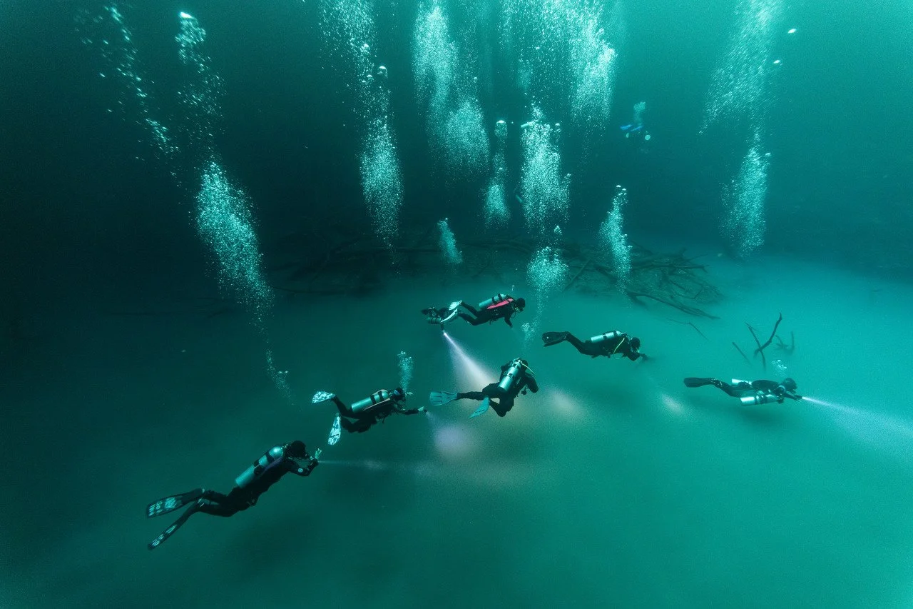 group of scuba divers above the 'cloud' in angelita cenote