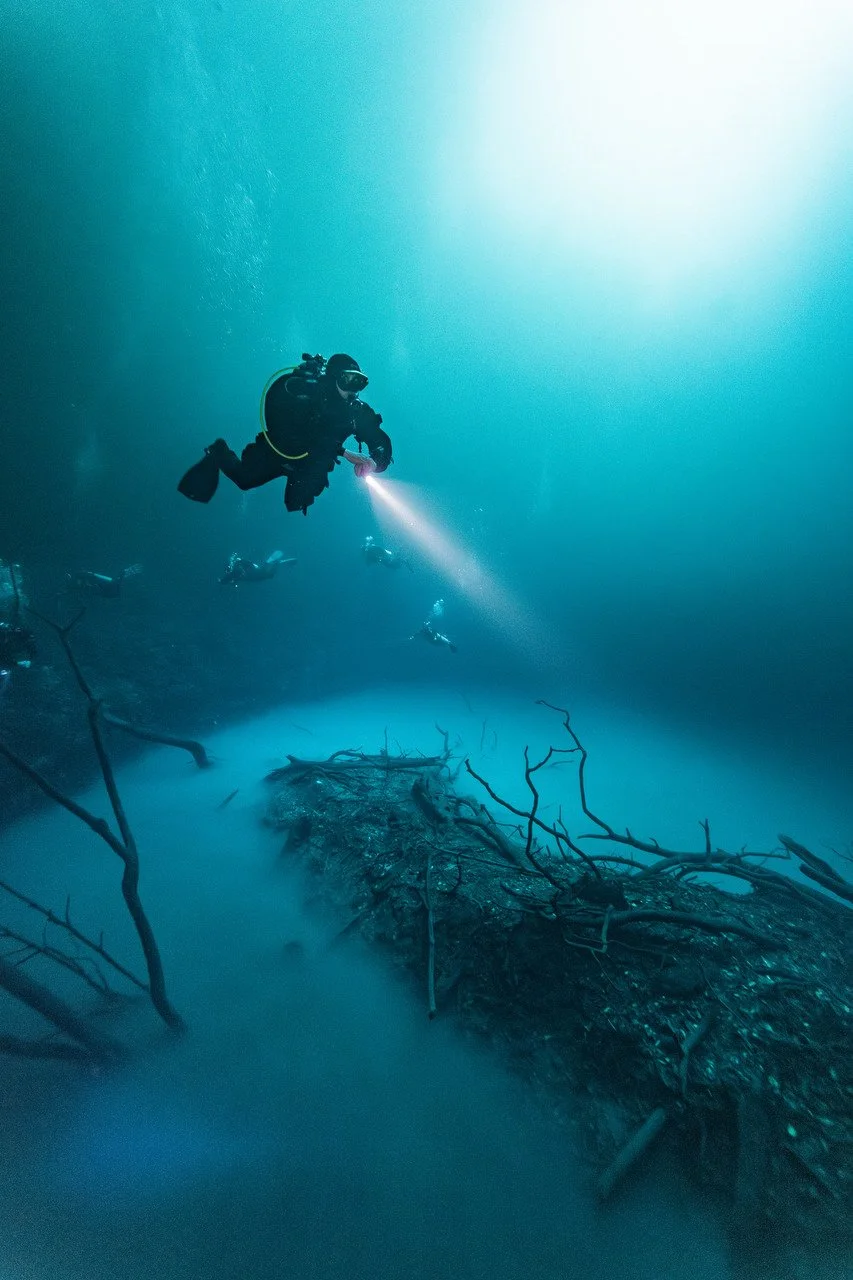 scuba diver above the island in angelita cenote