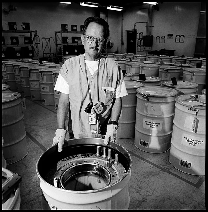 C.A. Nanstiel with a Pipe Overpack Component Waste Drum, RFETS, 2001