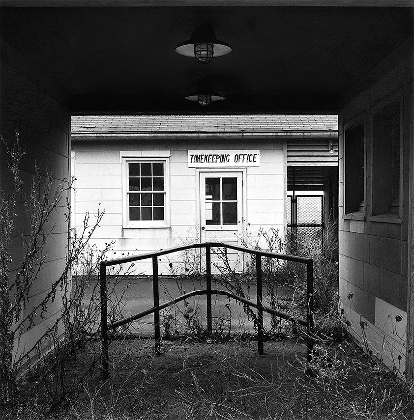   Timekeeping Office, BAAP, 2000   Employees passing through the inspection house on the way into and out of work were checked for contraband items such as matches and cigarettes.  