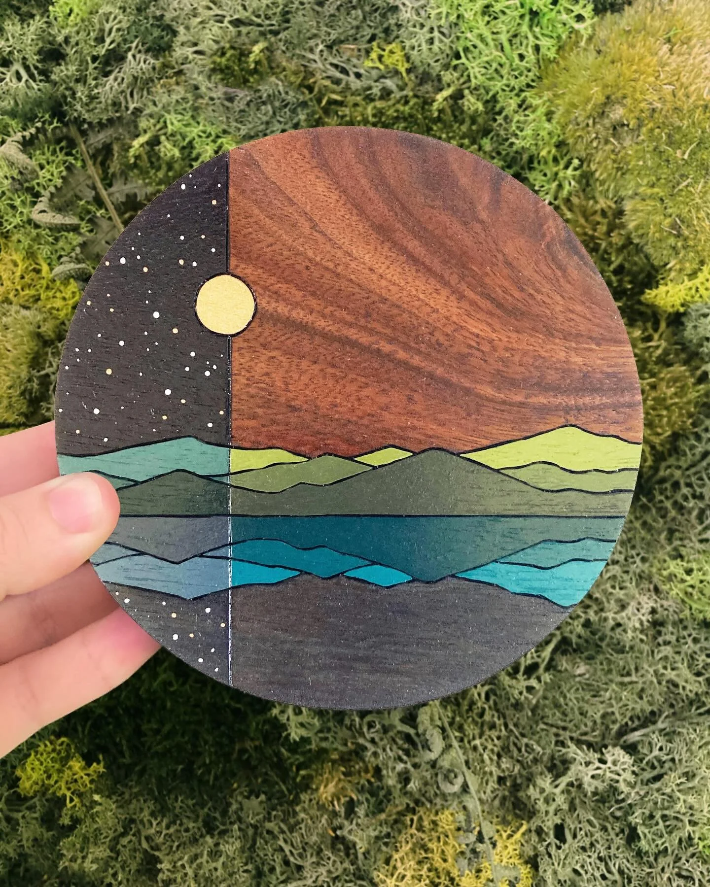 One of our newest wall art pieces added to the shop recently! It&rsquo;s a little walnut circle that&rsquo;s woodburned and painted with acrylic and watercolor. I love the wispy wood grain in the sky! We&rsquo;ll have this one at @thebigcrafty too!

