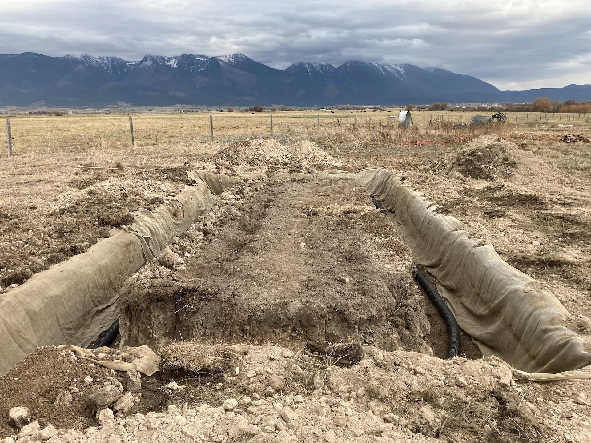 Another shot of the foundation trench.  Drain pipe heads towards a really deep section on the west side of the foundation trench.   