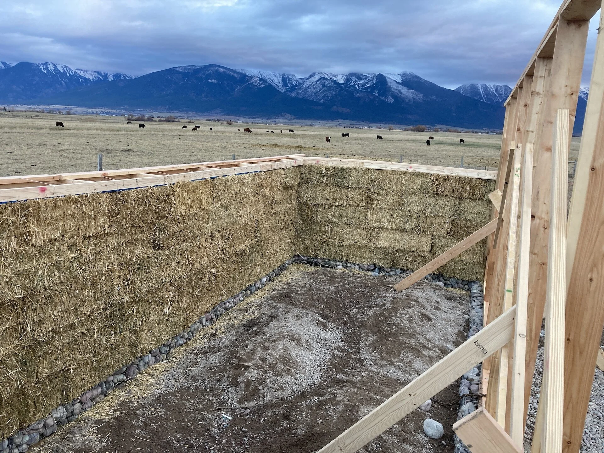  Another view from the west side of the structure.  Fastening the south wall to the top cap.   