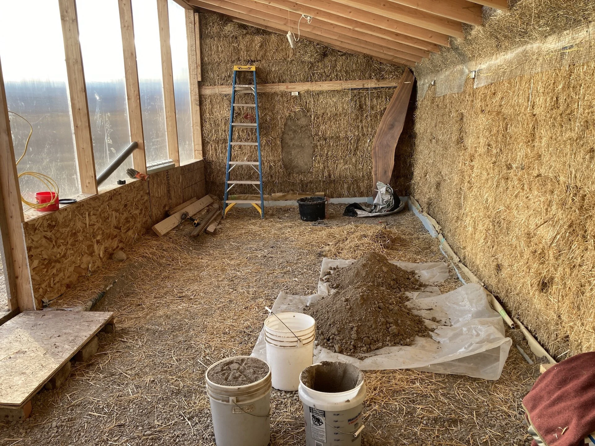  WIth the electrical installed (subpanel and circuits for lights, general outlets, heater, fan, etc.) it was time to start mudding.  Having never done this before we did a test section and gave it ~ 2 weeks to dry.  Our recipe consisted of loose stra