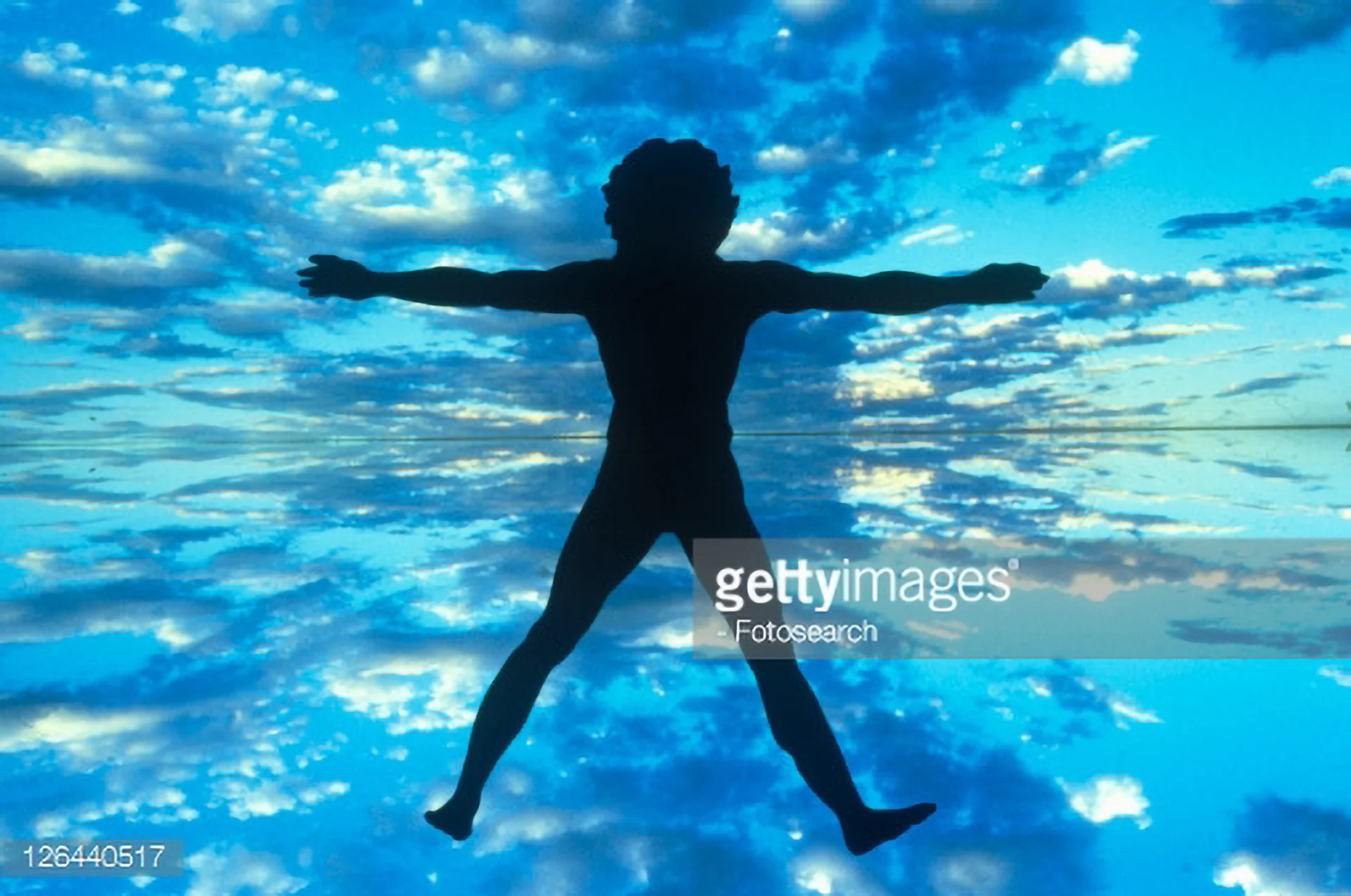 126440517-clouds-and-blue-sky-behind-silhouette-of-new-gettyimages.jpg