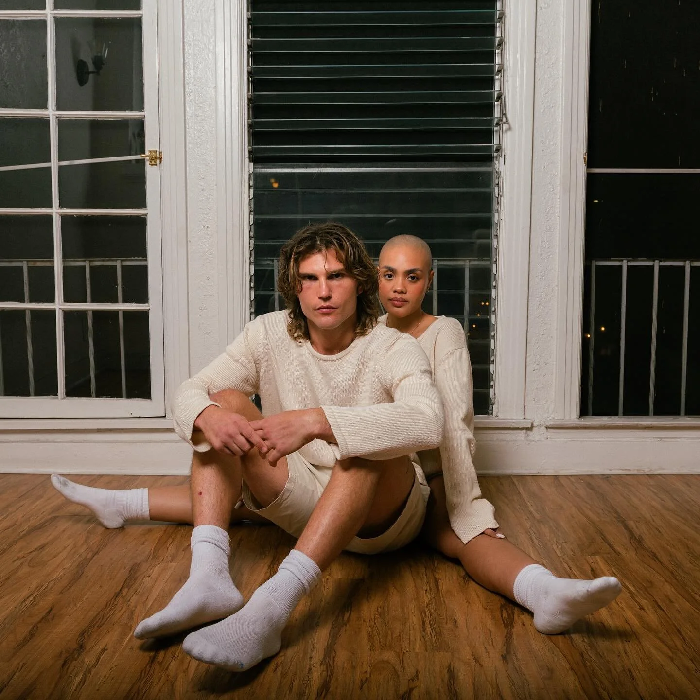 Carolina and Danny in our cream sweaters, we&rsquo;re already down to our last few 🕊️