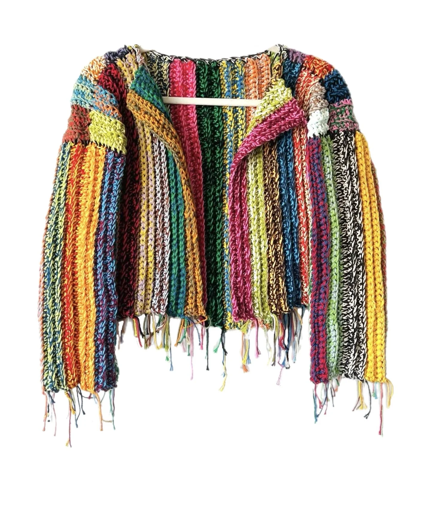 Colorful, rainbow-striped knitted sweater hanging on a white background.