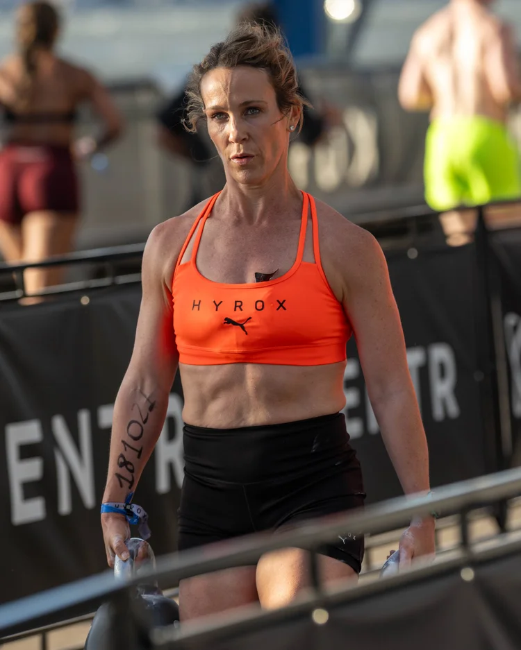 Linzie Hebert walking through the course at HYROX NYC