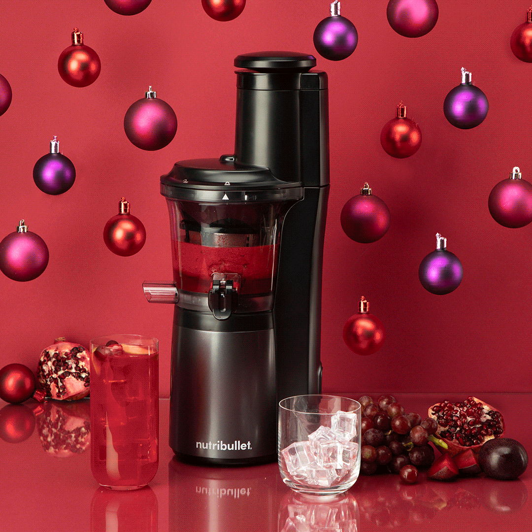 NB_Slow-Juicer_Lifestyle_Holiday_Cocktail-Pour_RedBkgd_GIF_1080x1080.gif