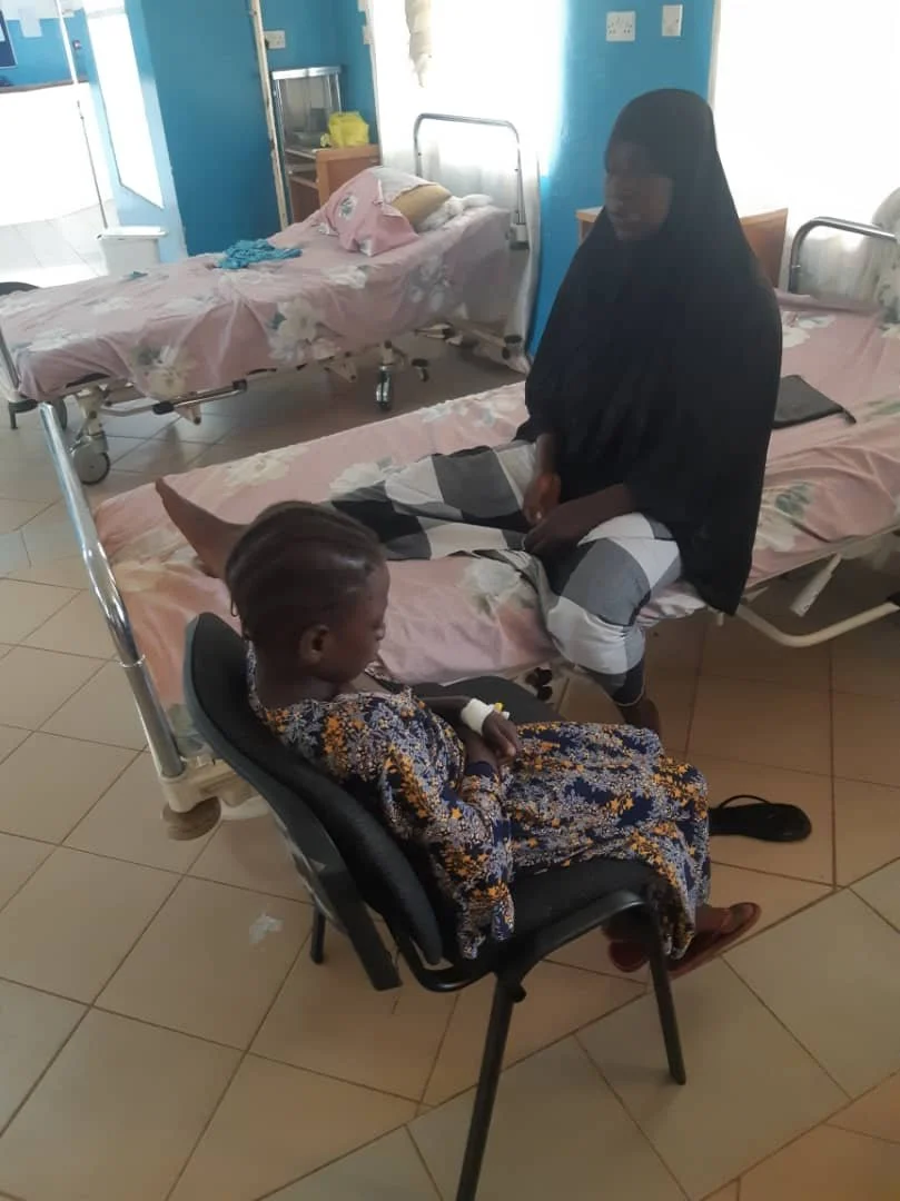 Maimuna follow up examination with Mum.jpg