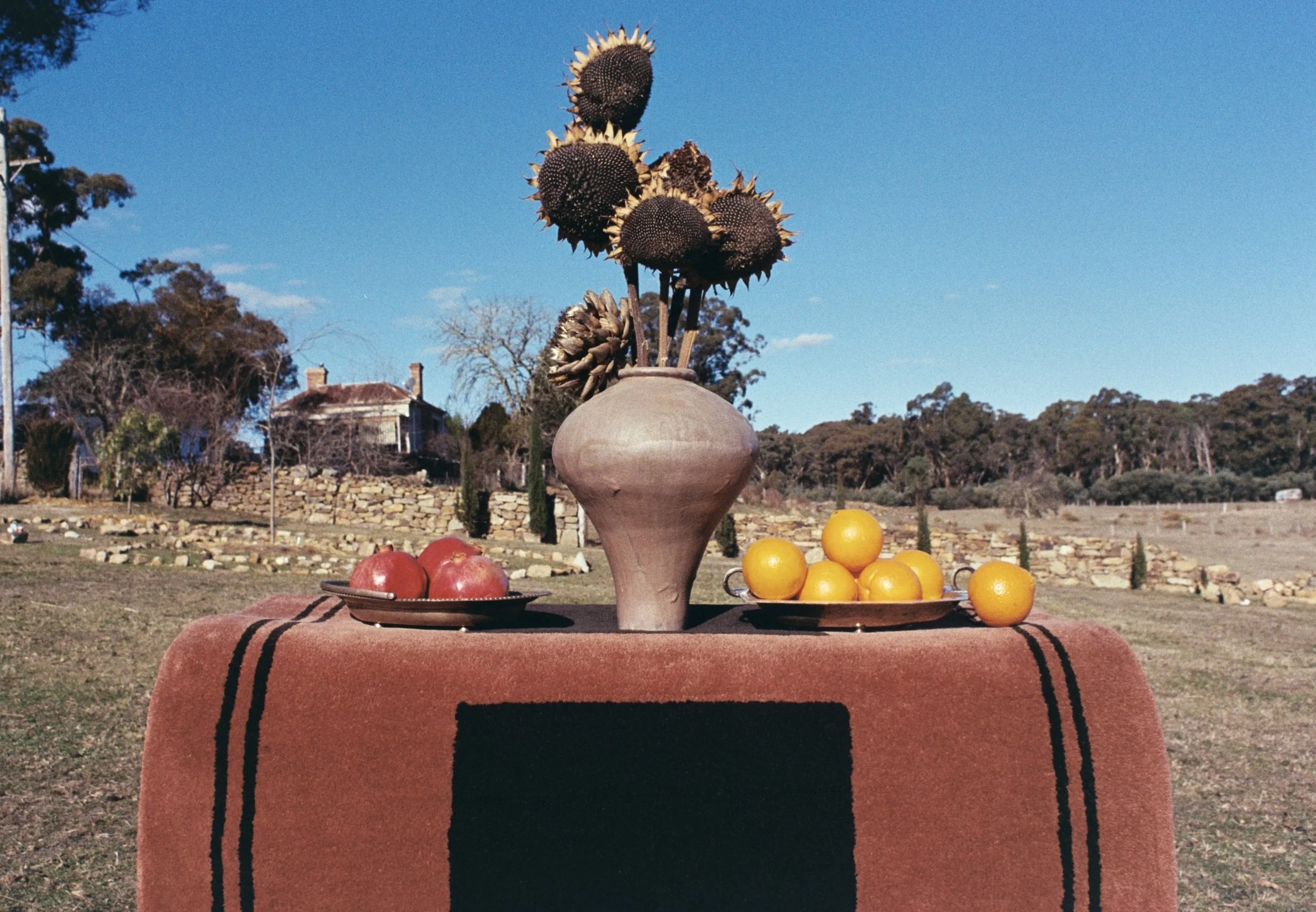 Cayugas Rug by Zouzou Rugs in rust-brown with minimalist overlapping square motif, hand-tufted modernist design