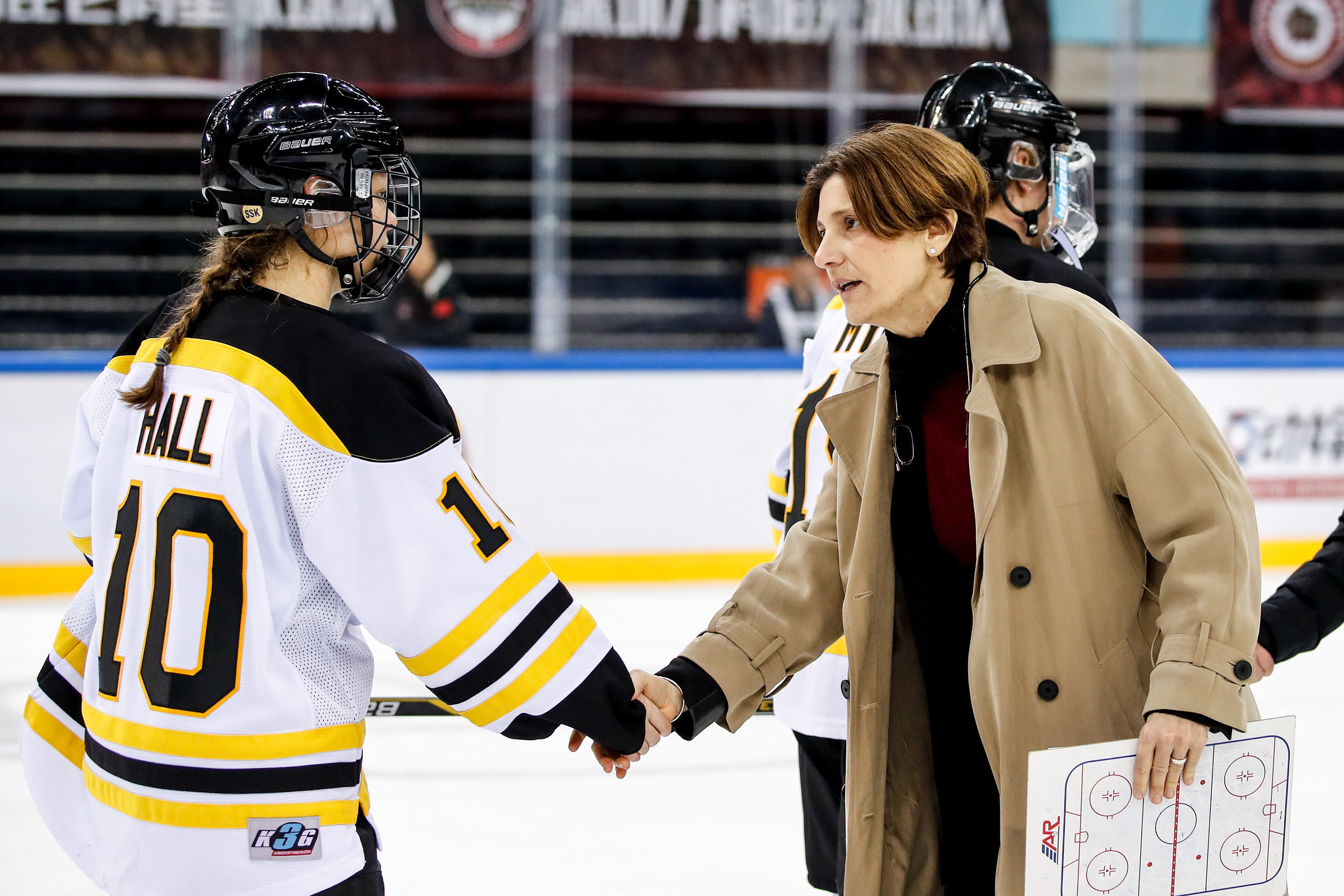 Digit shaking hands with Blades player in line.jpg