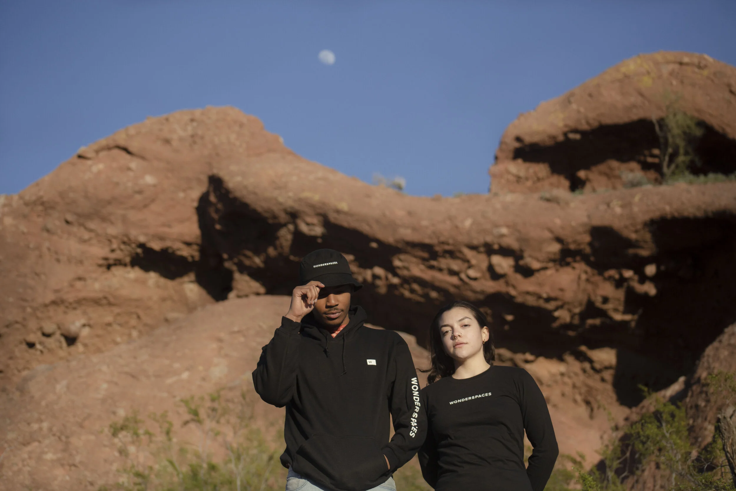 Black hooded sweatshirt (S, M, L, XL, XXL) $40 Black long sleeve t-shirt (S, M, L) $18 Black bucket hat $16  Photo by Yadira Villarreal