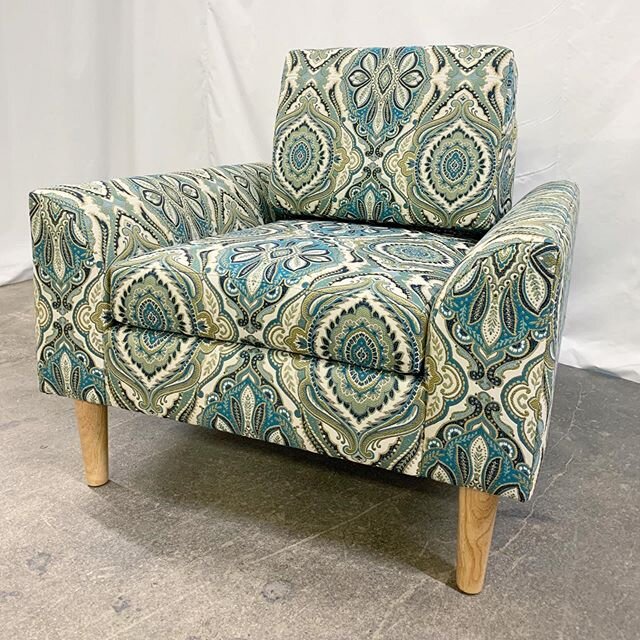 A custom shape newly completed for a client wanting mid-century vibes, a firm upright back cushion, and high legs. Fabric is by @trendfabrics - pattern 04295 'Peacock', available through @designerschoicerc 
#midcenturymodern #customsofa #madetoorder 