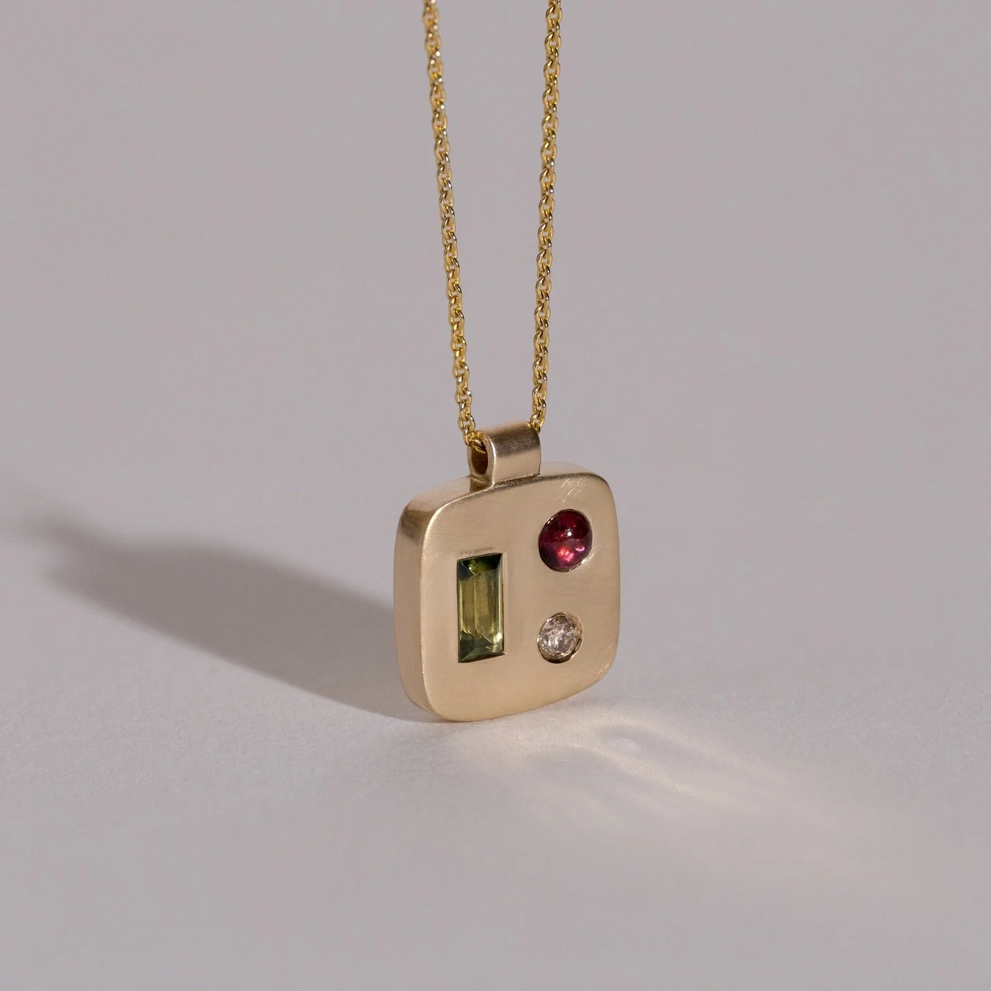 Kvadrat Abstract Pendant No. 1 &mdash; one of one. A careful study in balance, where the stones are set not as separate parts but shaped directly into the gold as a singular sculptural form. 

Handcrafted in 14k gold with a brushed satin finish and s