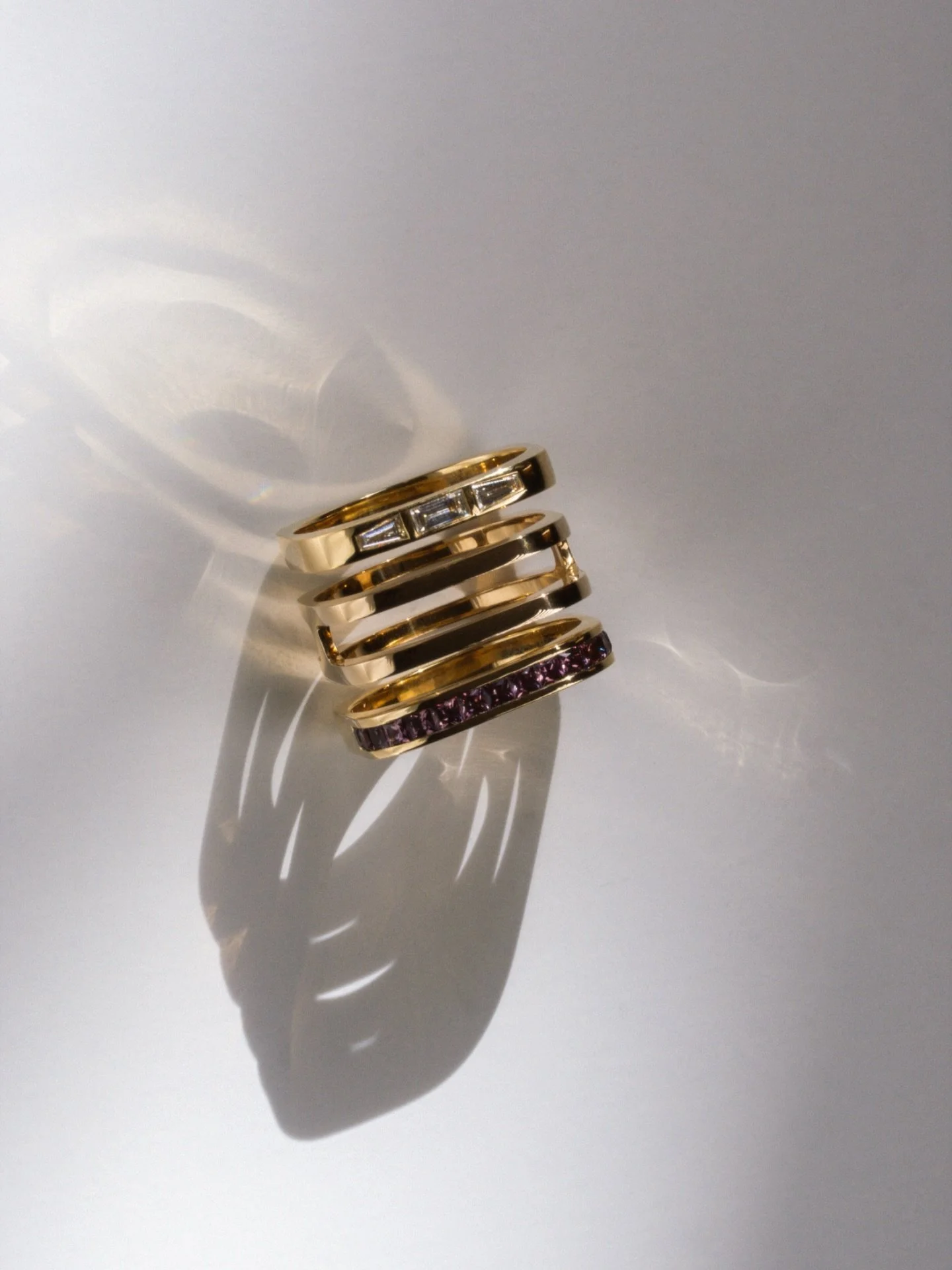 I. Kvadrat baguette trio ring
II. Kvadrat parallel no. 1 ring
III. Kvadrat channel set aubergine sapphires ring