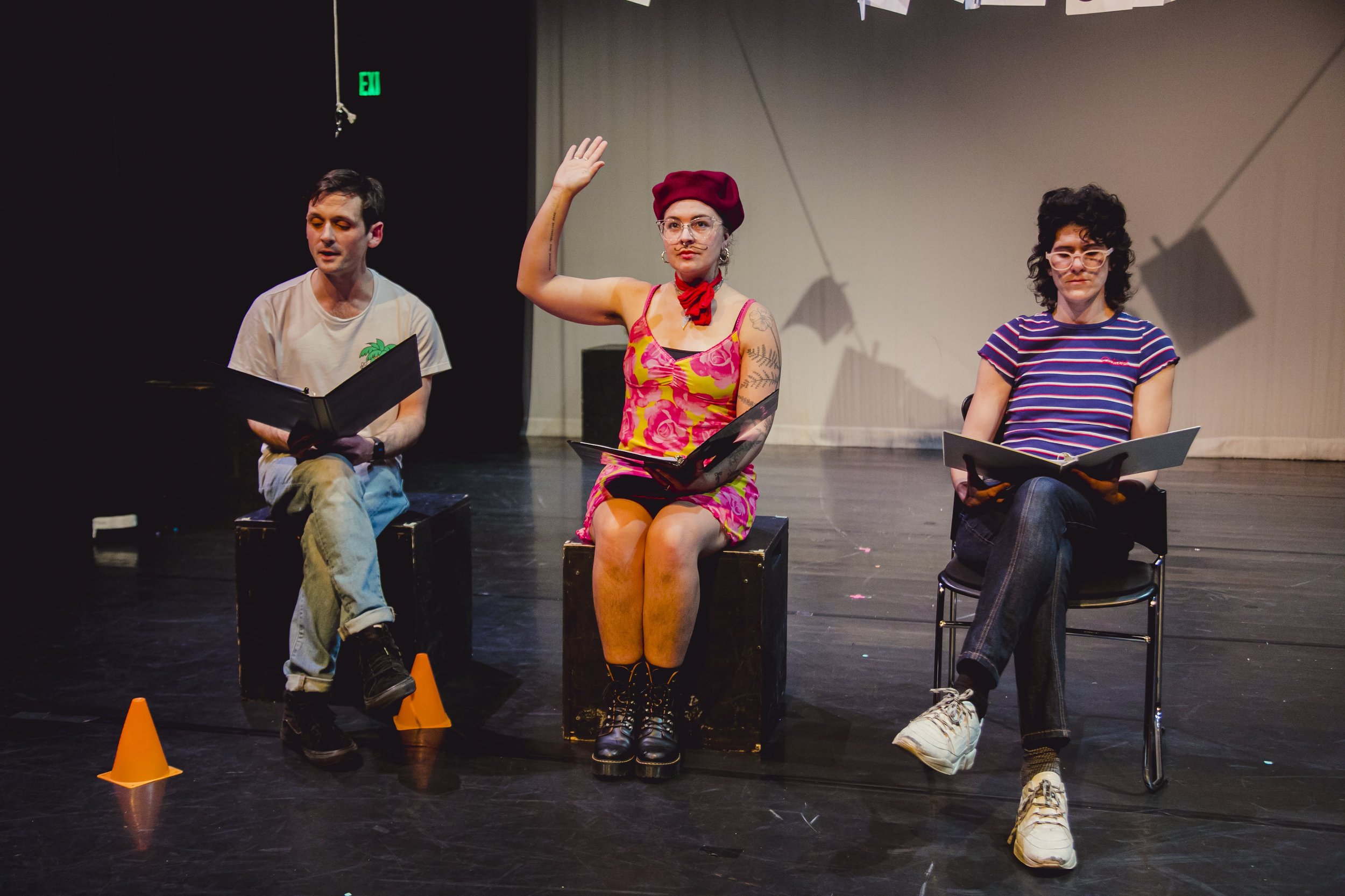 Sam Bertken, Andie Patterson, and Geulah Finman in "And now, premiering for the first time this weekend, the future of art, of theatre, of Neo-Futurism..."