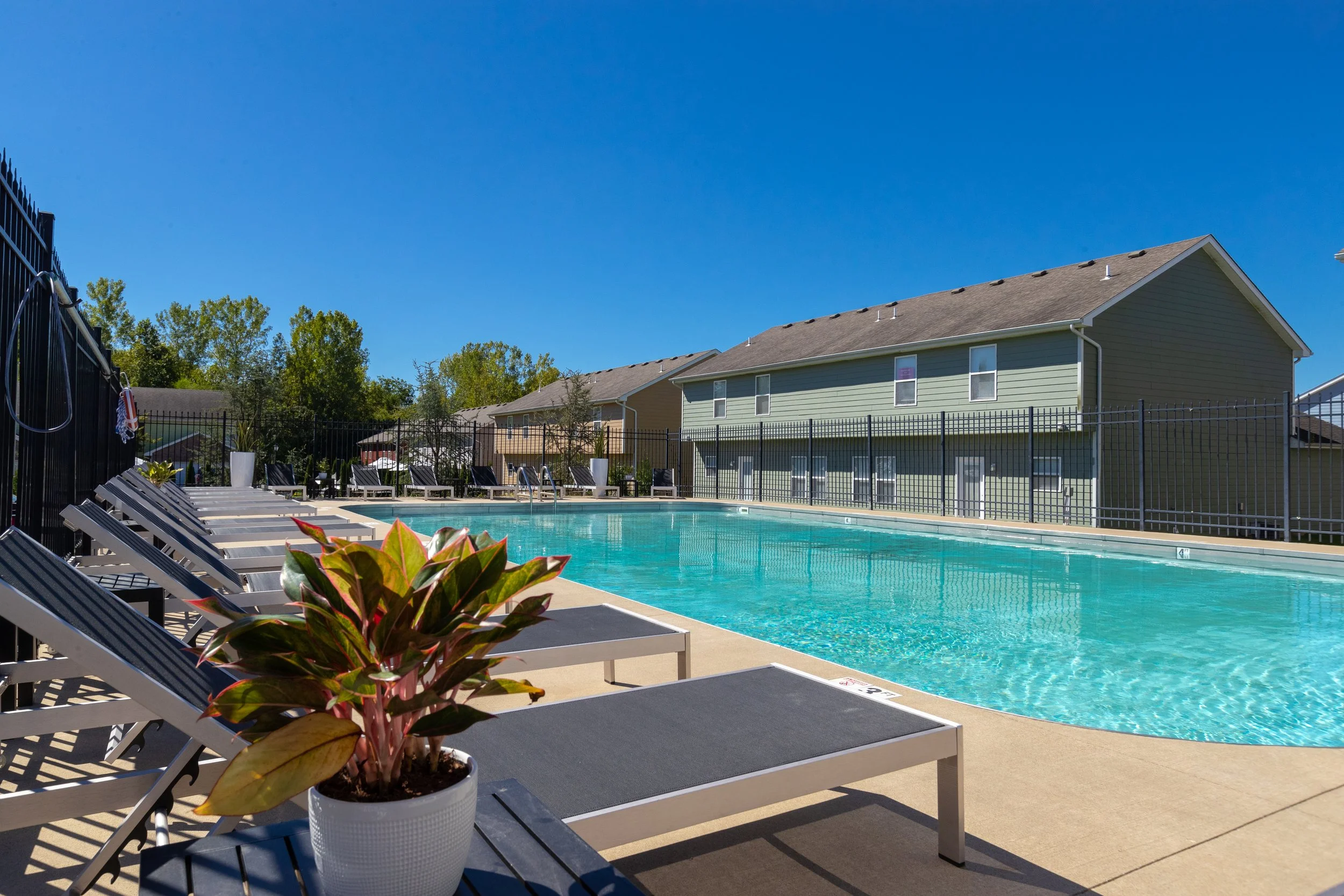 The-Row-Apartments-Near-University-of-Missouri-Pool-with-Lounge-Chairs.jpg