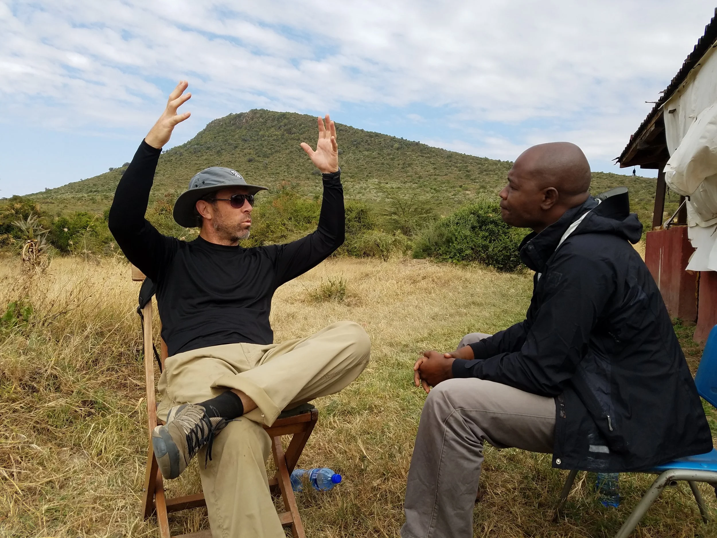 Andy and Edward discussing the water crisis and well solution.