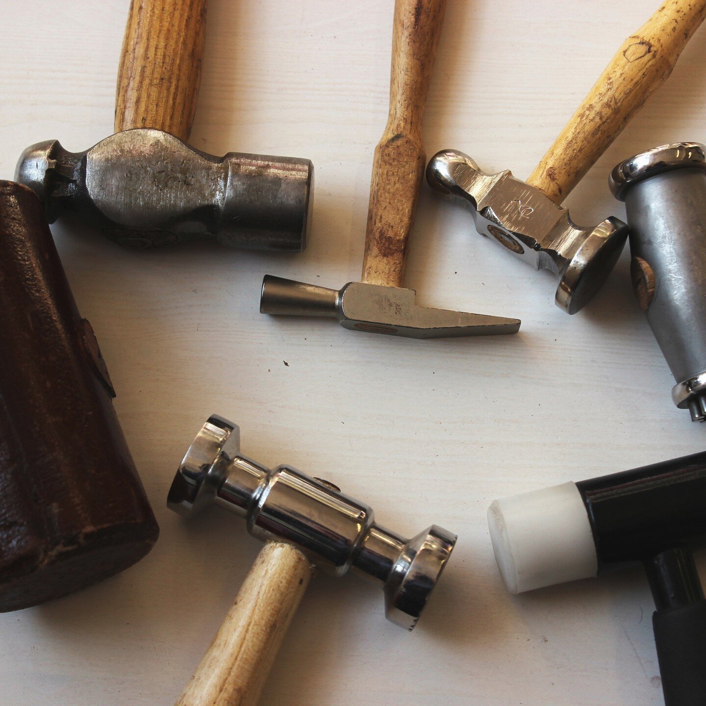 Metalsmiths and jewelers use a variety of hammers to get the job done. We love to nerd out about all the different types!⁠
⁠
Just to name a few on our benches: ball-peen hammer, chasing/ repousse hammer, goldsmith hammer, rawhide mallet, deadblow mal