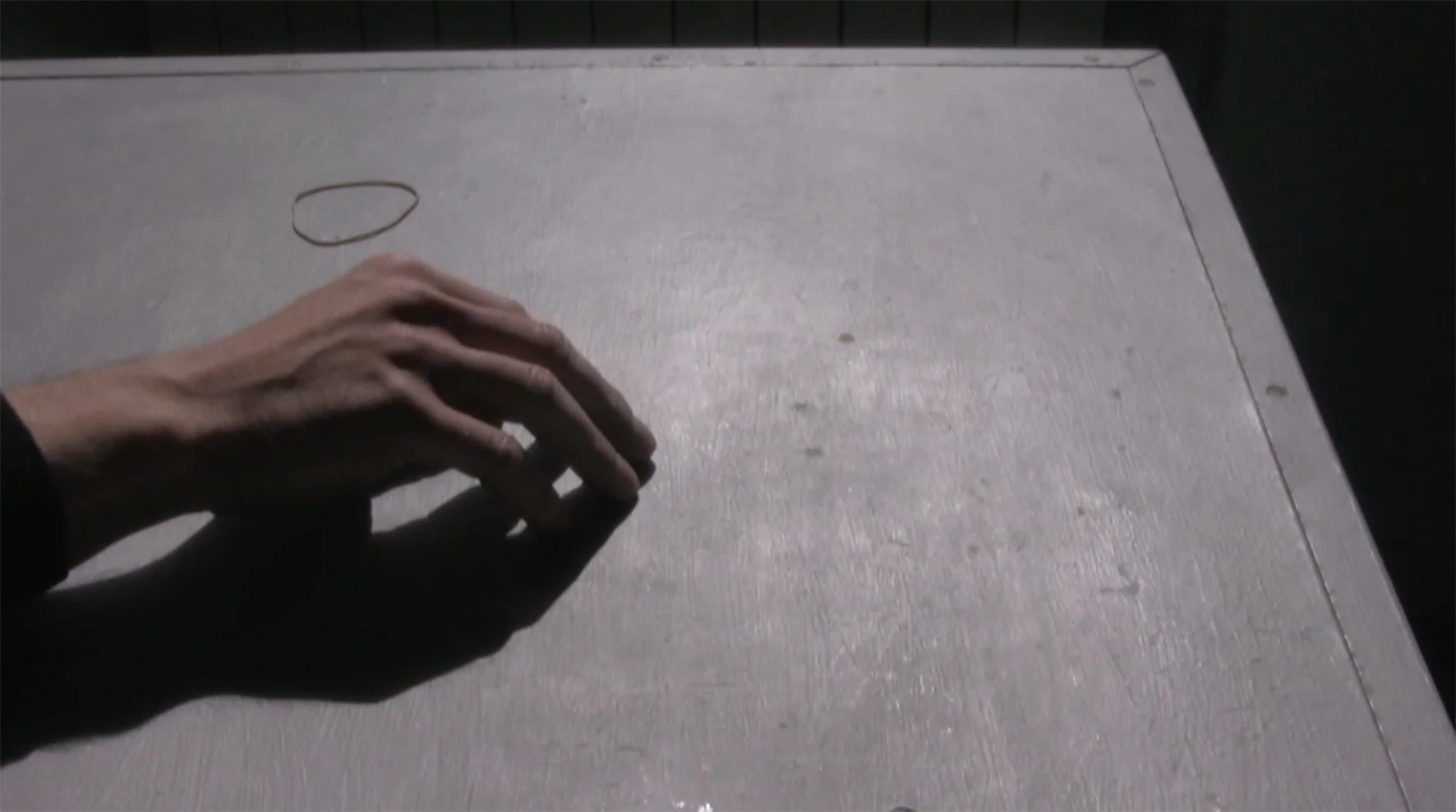 Fingers Through Elastic Over Table (2015)