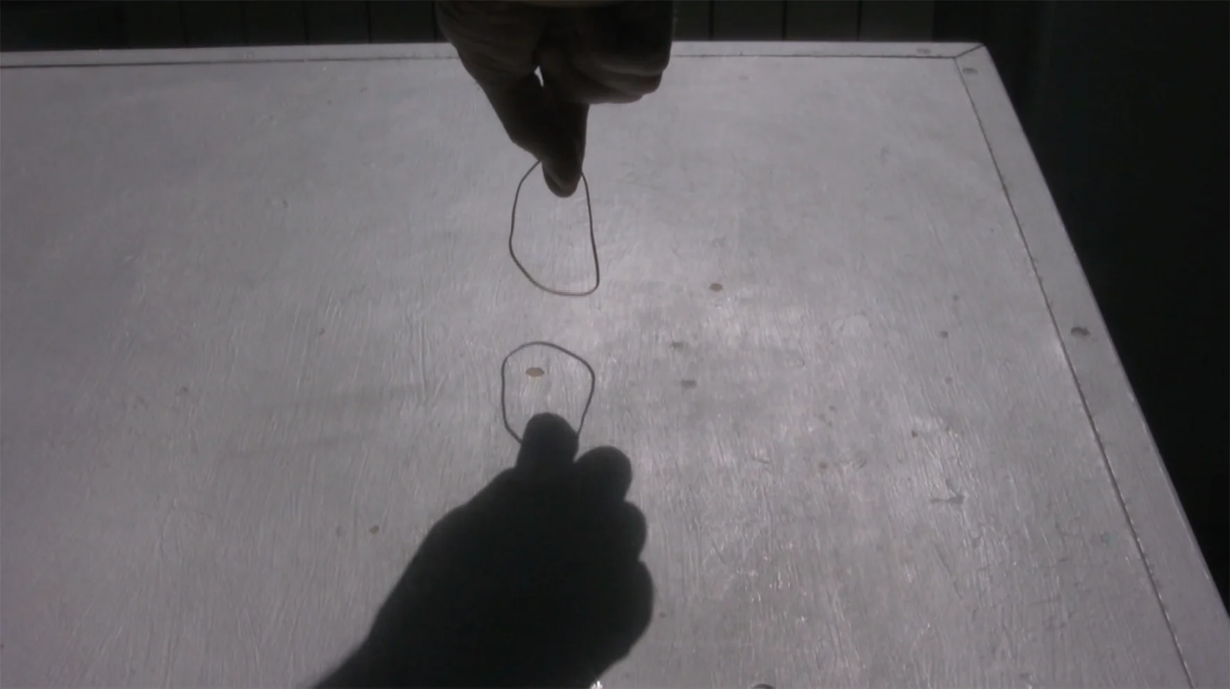 fingers through elastic over table_Luzar_image2_72dpi_.jpg