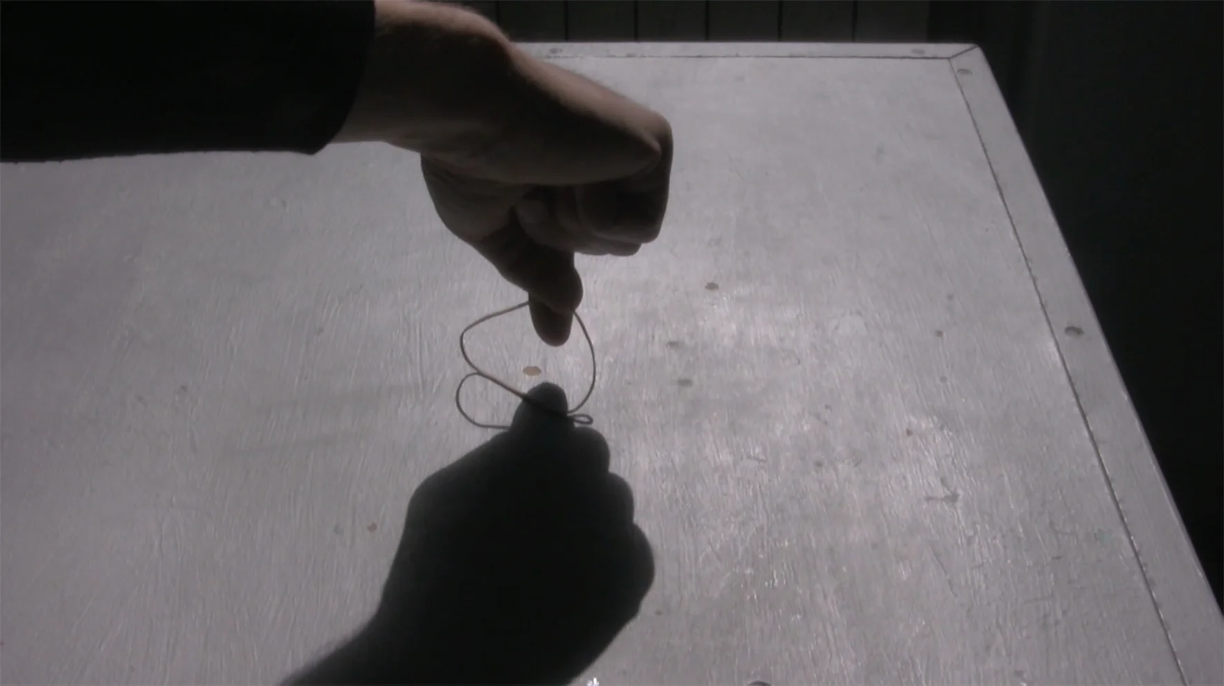 fingers through elastic over table_Luzar_image3_desktop.jpg