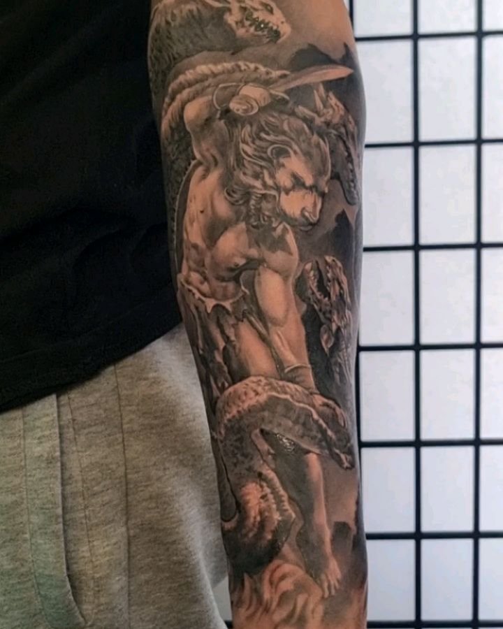 @it_is_lom completed this full lower arm in only 2 sessions.

A depiction of Hercules battling the lernaean Hydra on the inner arm with Theseus and the Minotours maze sitting on the outside.
Eventually to be continued into a full sleeve.

And if you'
