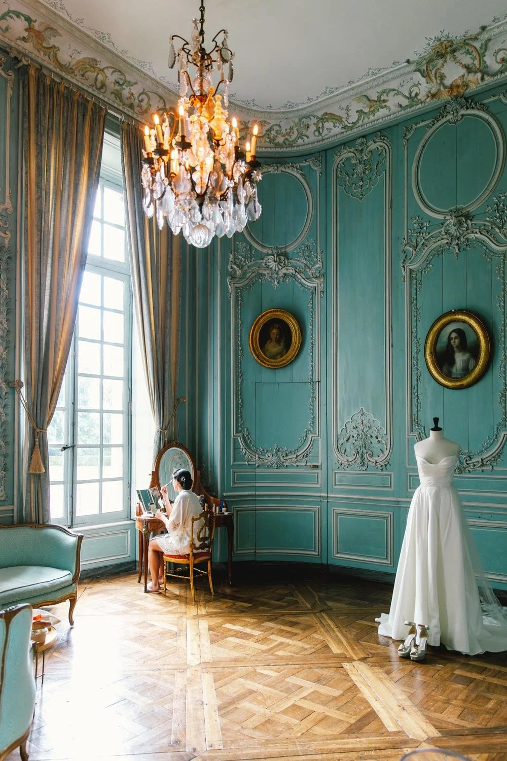 Bride preparing for her wedding in the blue salon at Château de Champlâtreux, France
