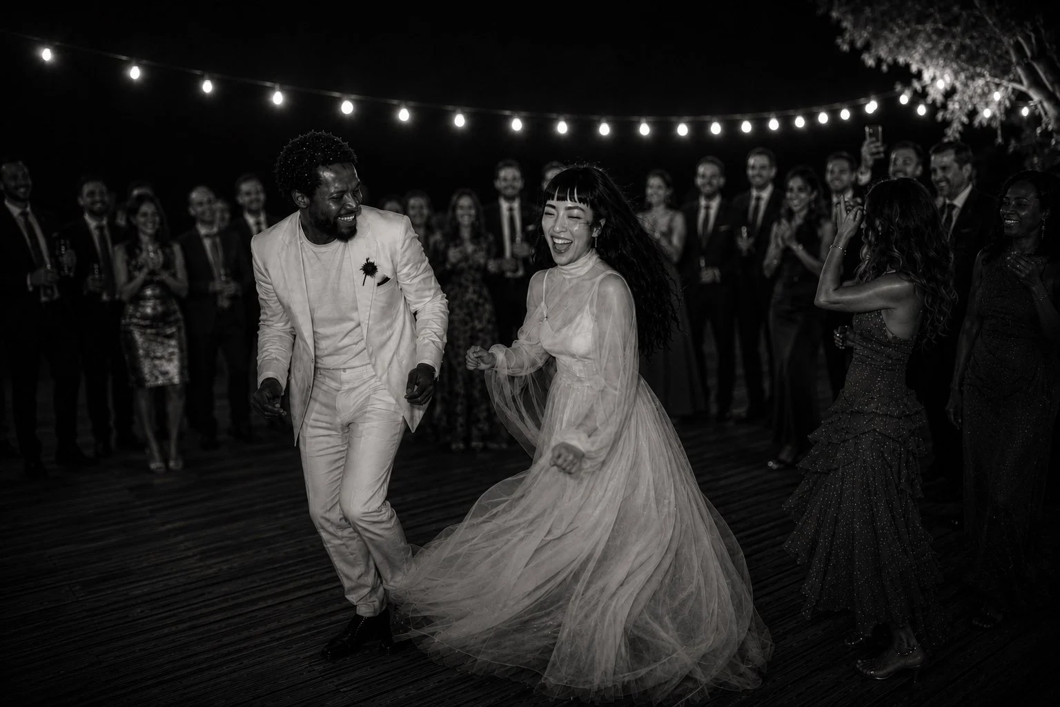 Bride and groom celebrating with their guests during a luxury destination wedding reception in the Camargue, France, photographed by a high-end wedding photographer.