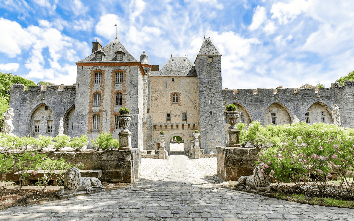 Medieval architecture of Château de Farcheville wedding venue near Paris with stone courtyard and gardens