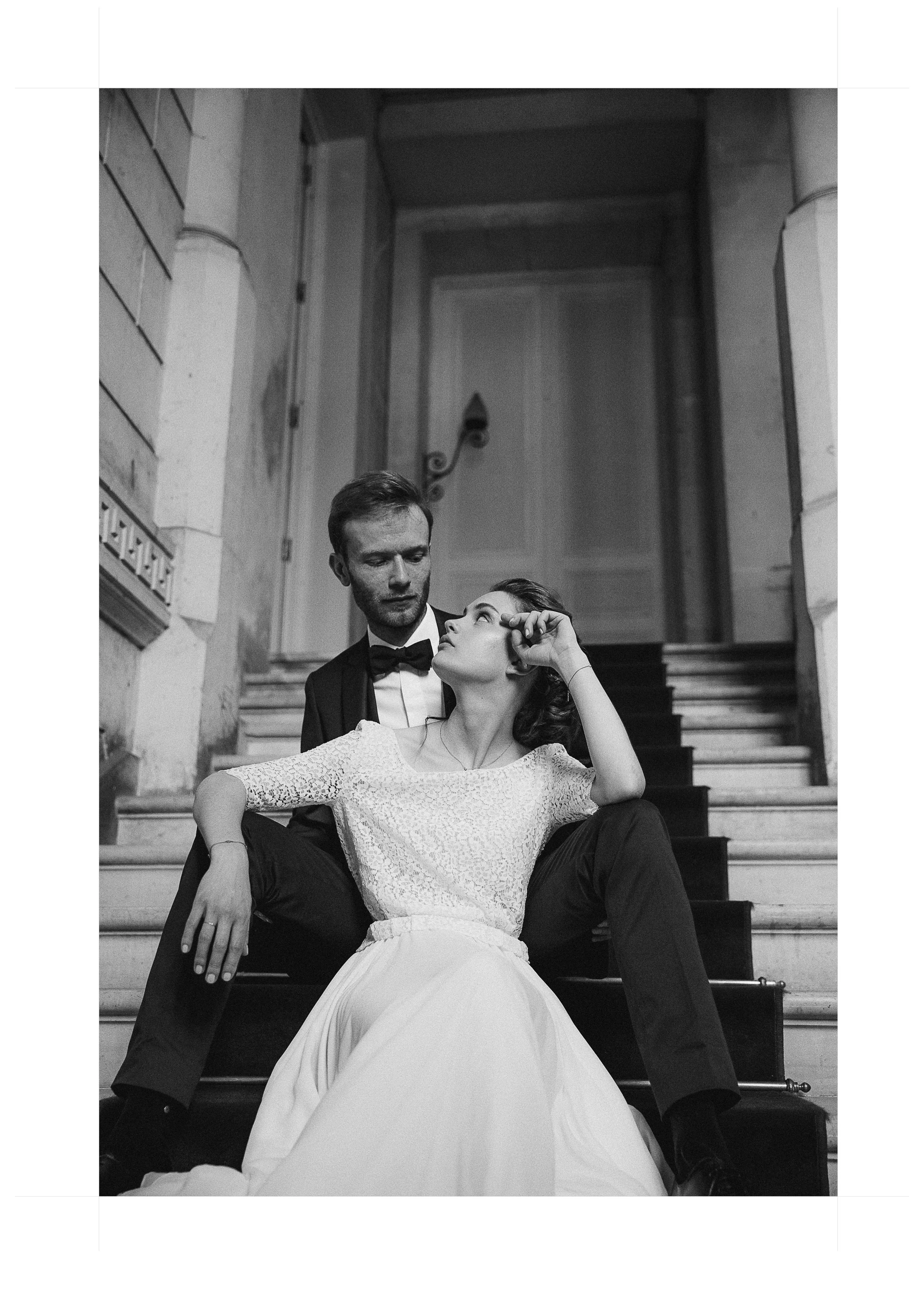 bride and groom portrait on the monumental staircase of Château de Baronville near Paris wedding venue
