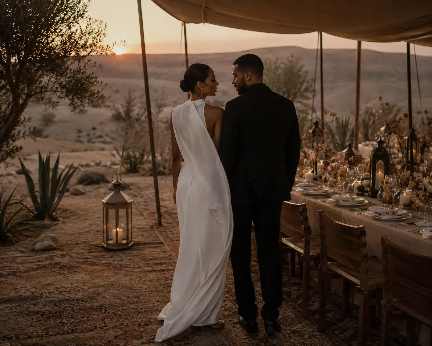 Editorial luxury wedding in the Agafay Desert, Marrakech, featuring an intimate dinner under linen canopies at sunset.