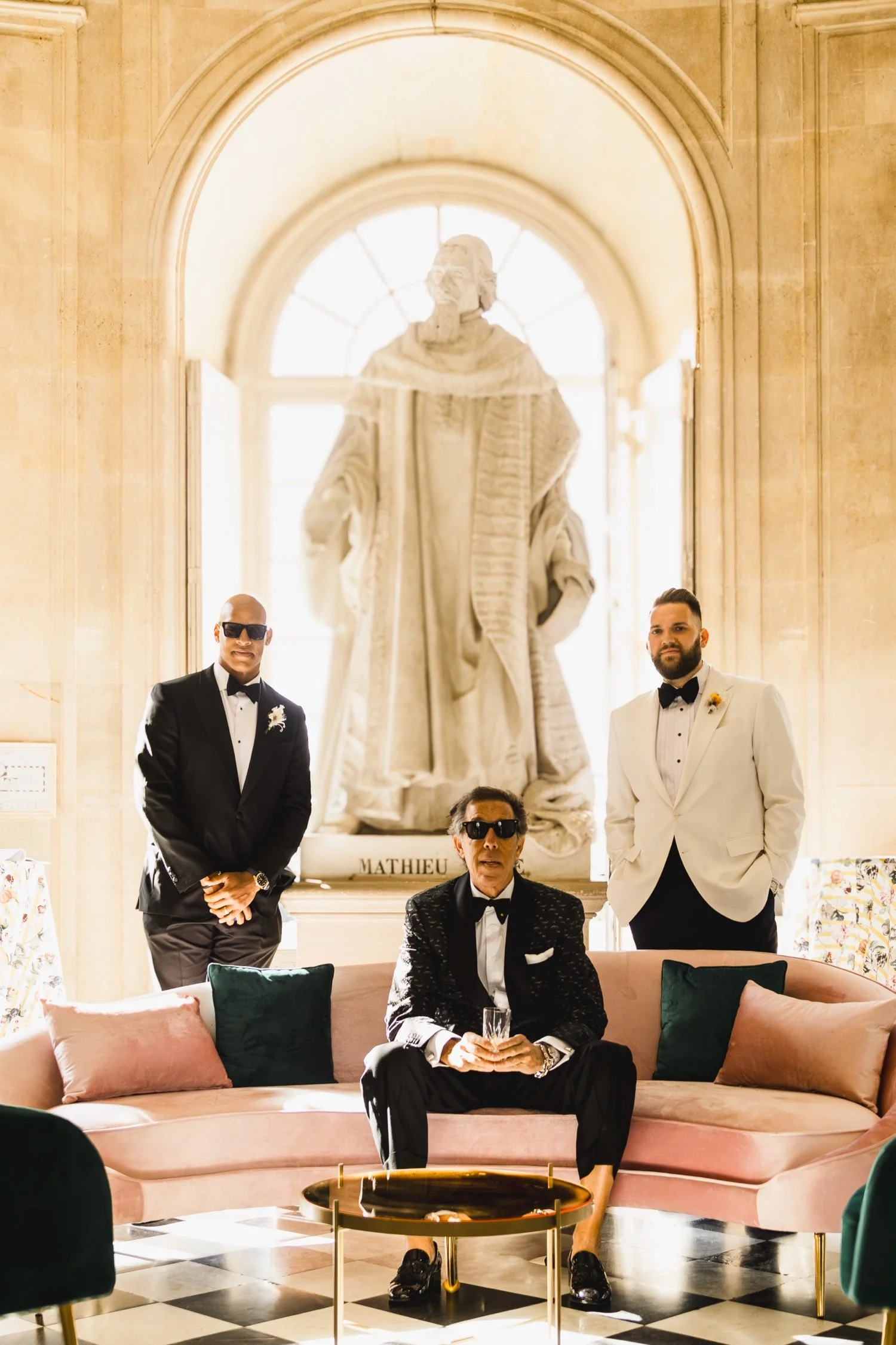 Groom with his father and best man in the private salons of Château de Champlâtreux near Paris