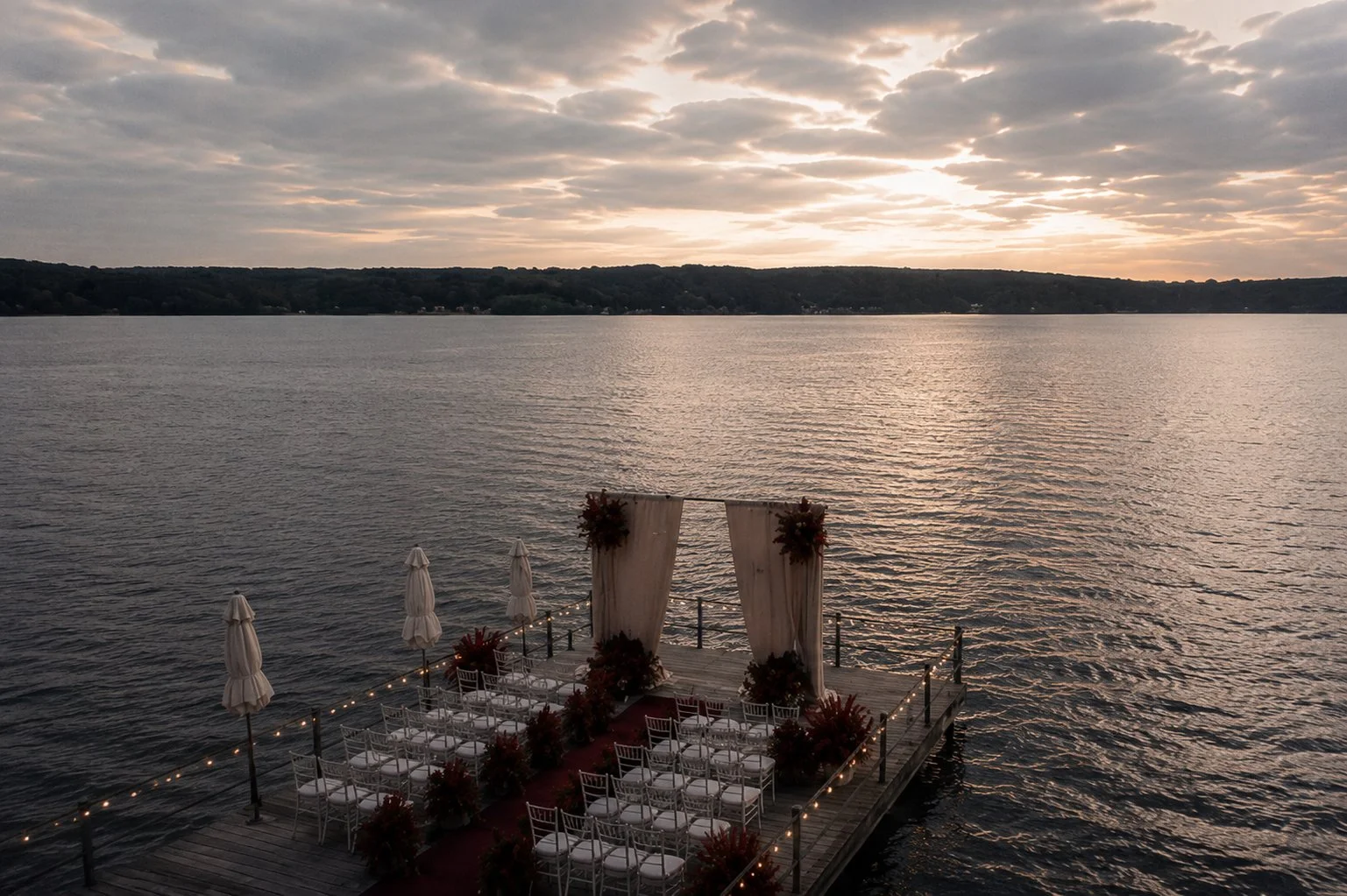 Elegant lakeside ceremony setup for a luxury destination wedding in the Camargue, France, photographed by a high-end wedding photographer.