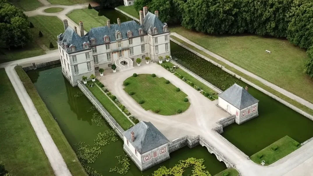 Luxury wedding venue Château de Bourron near Paris surrounded by gardens and moat