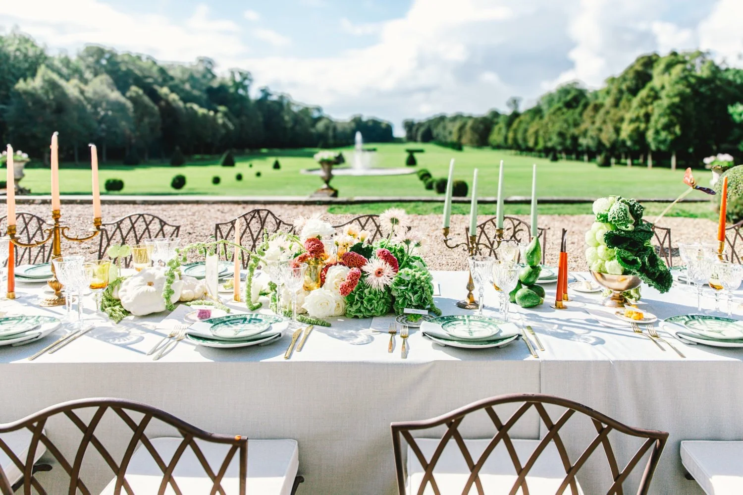 Summer wedding table set in the gardens of Château de Champlâtreux, France
