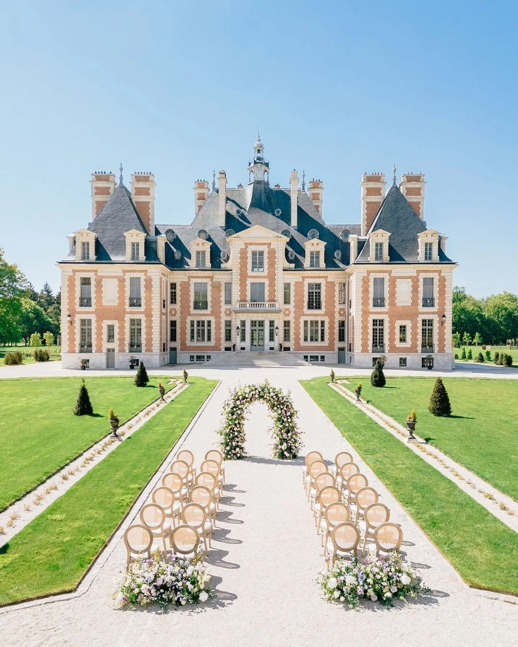 Luxury outdoor wedding ceremony at Château de Nainville-les-Roches near Paris, France