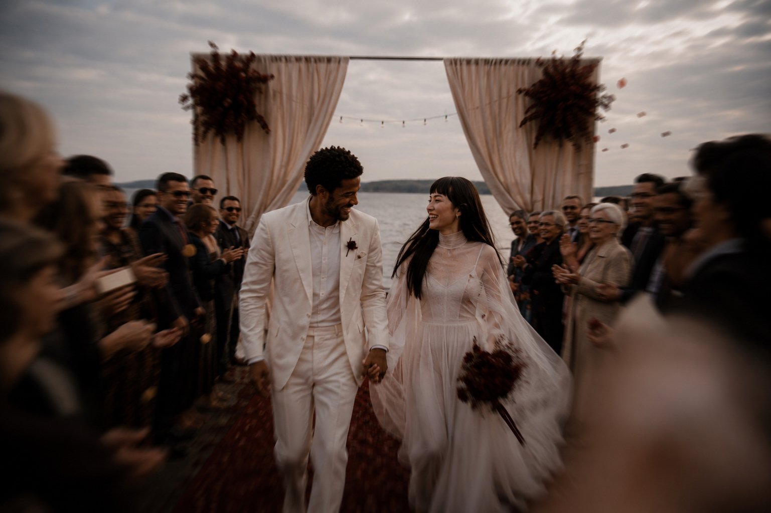 Newlyweds walking hand in hand after a luxury destination wedding ceremony in France.