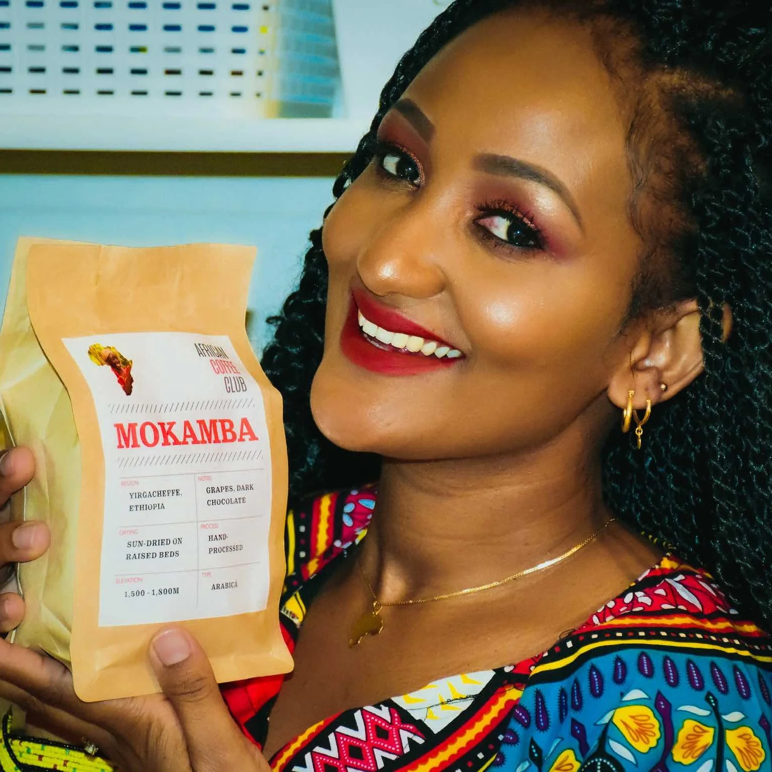 Momkamba_model_holding_bag.jpg
