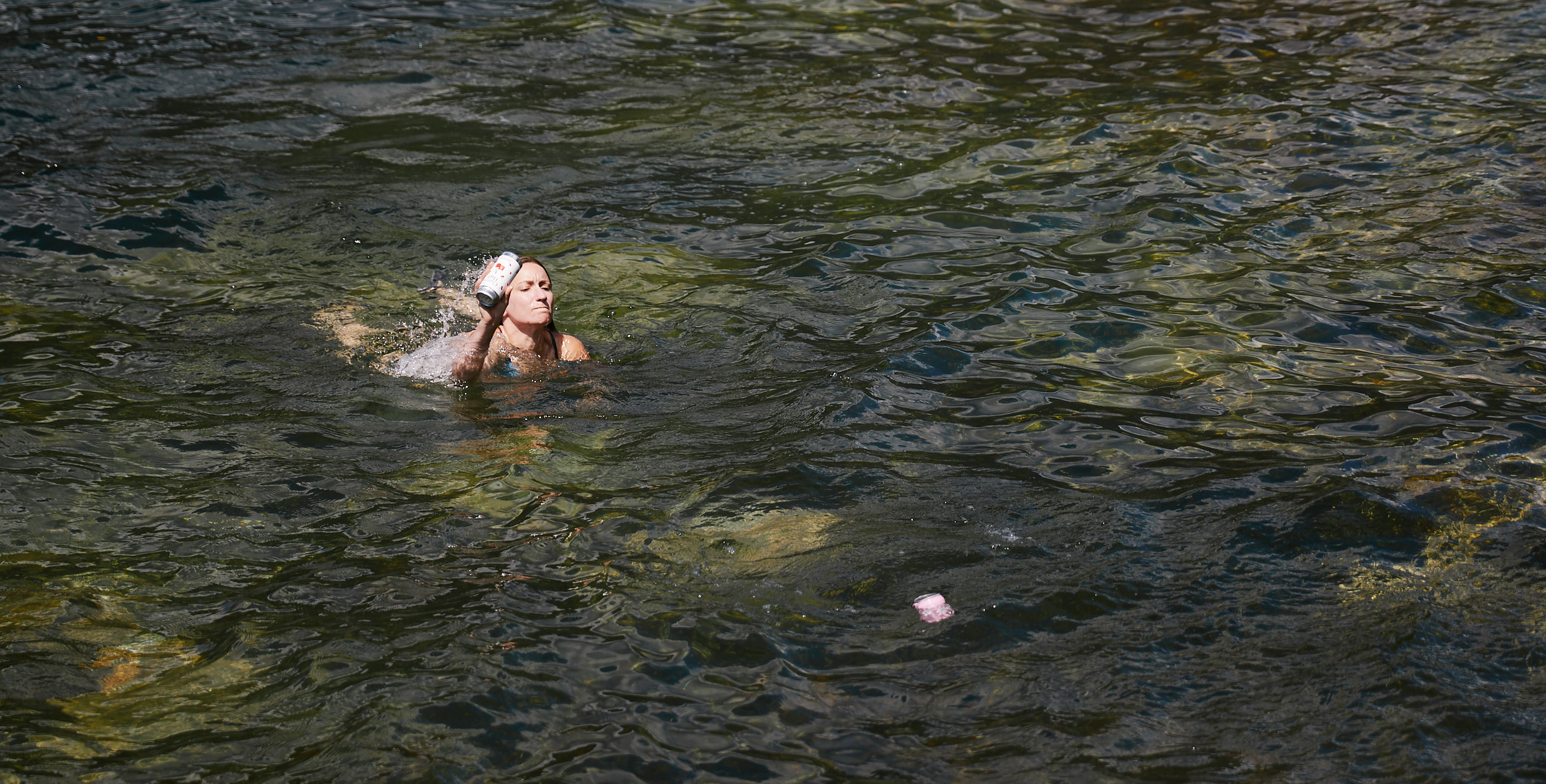  Jenn had to brave the jelly fish to rescue two beers that we had put in the water to chill and had then washed away. 