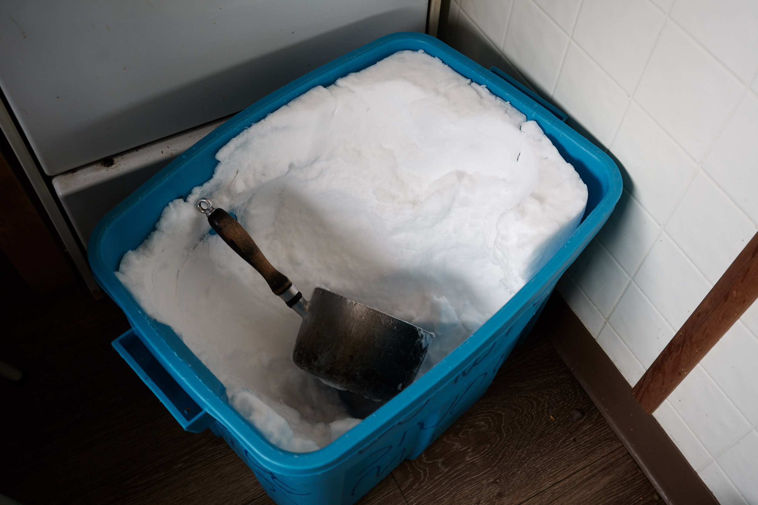  A few times a day we would fill 3 of these large tupperwares with snow to then later melt for drinking water. 