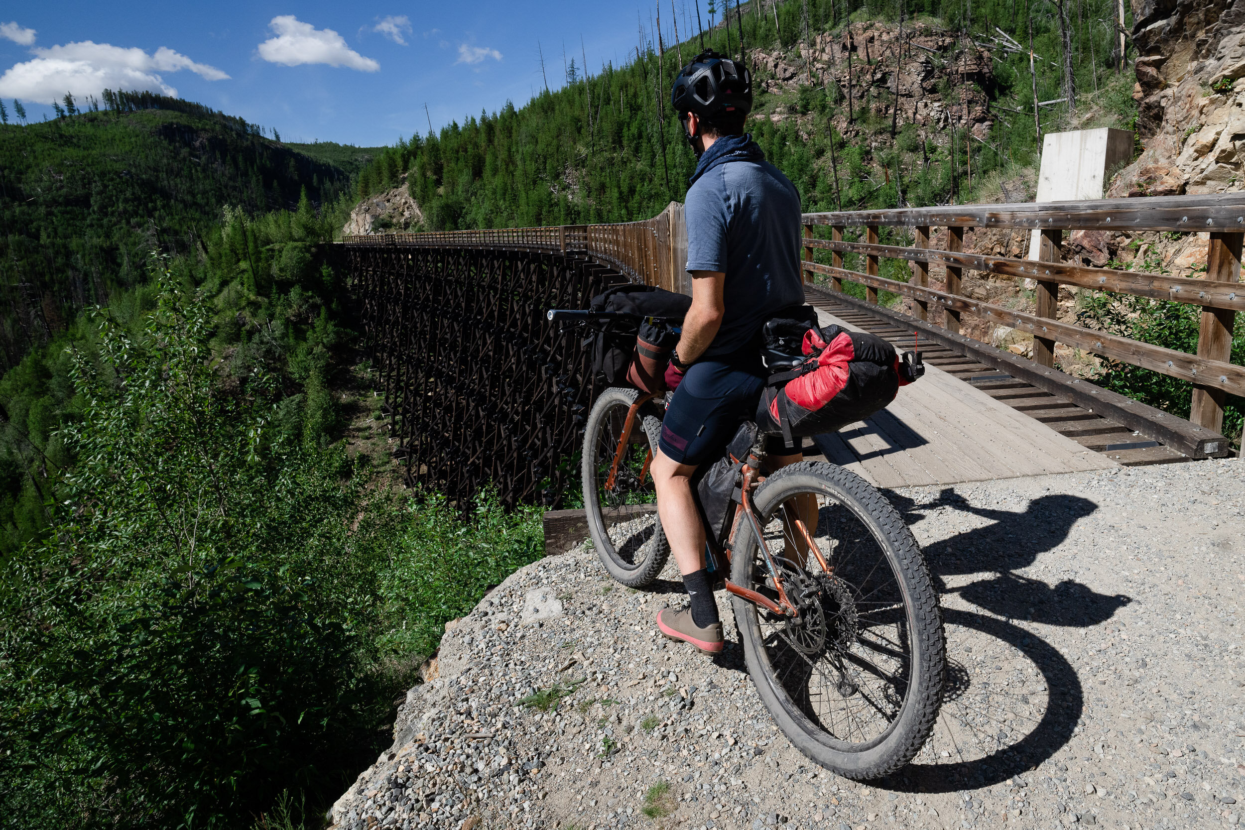 The Myra Canyon Trestles originally transited between Midway and Penticton. When the railway was built, the section of railway between Myra station and June Springs station required 18 wooden trestles and two tunnels in order to traverse the deep ca