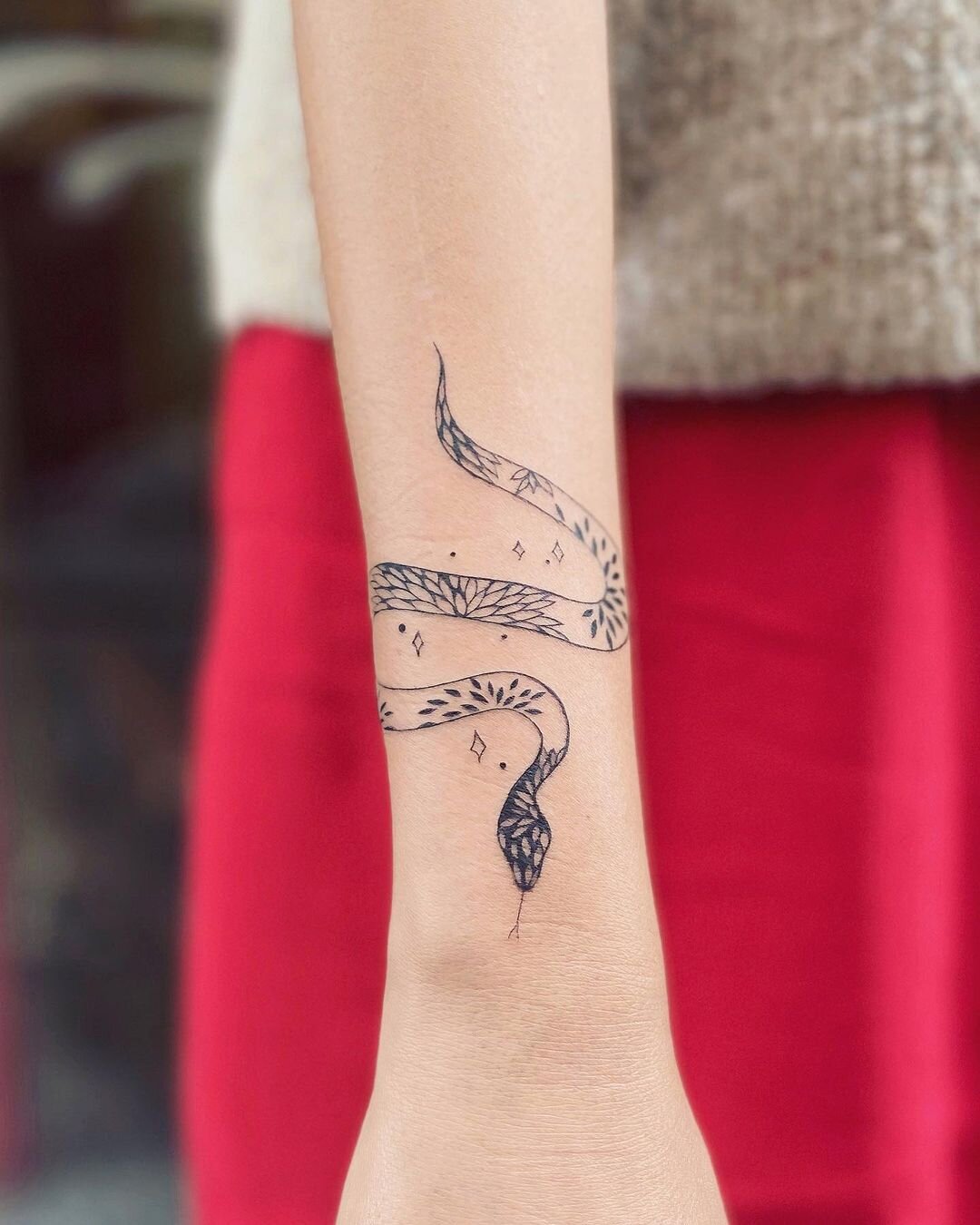 snake tattoo wrapped around wristTikTok Search